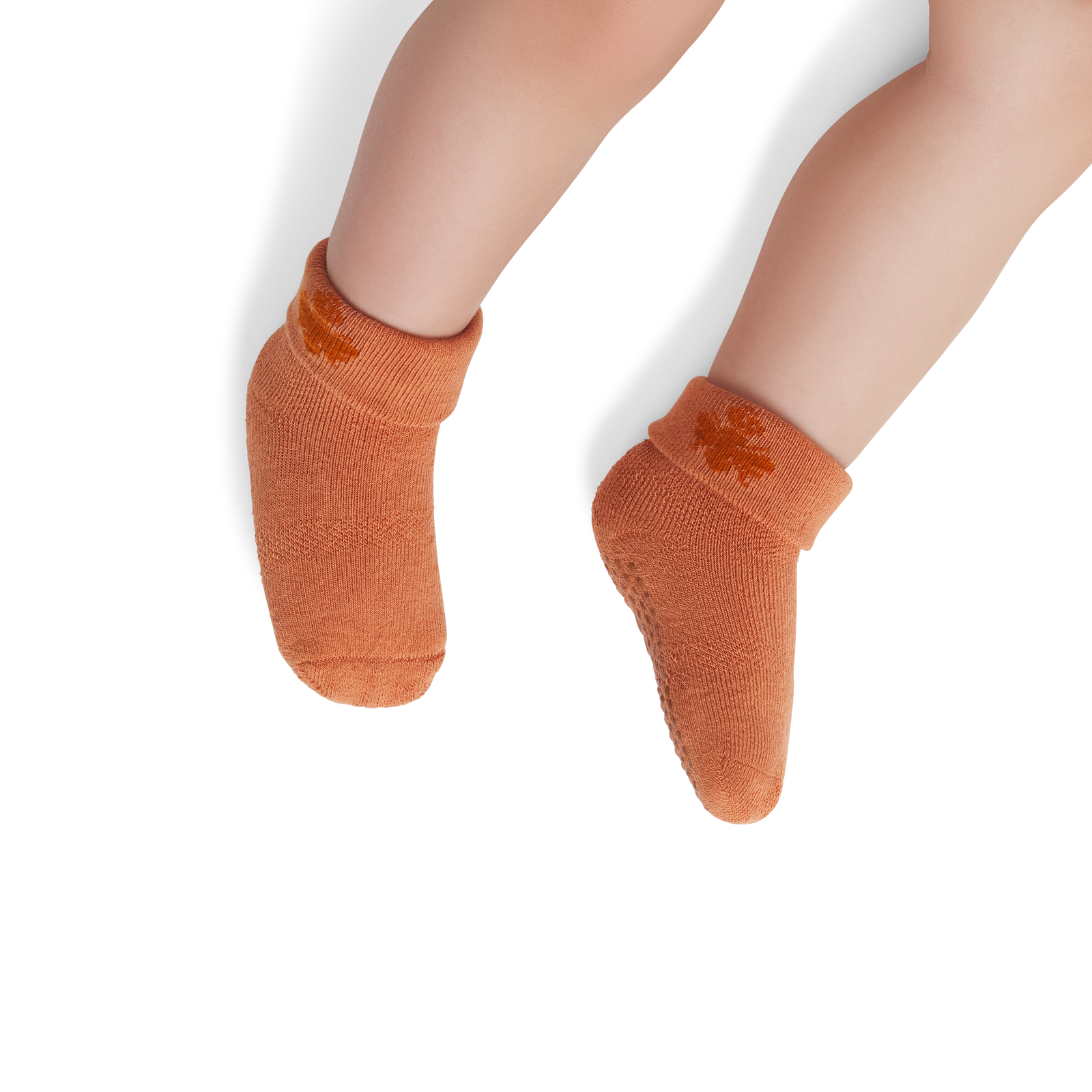 official-bombas::6575-adobe-richcopper-baby-6-12-unisex-onmodel-2-transparent.png
