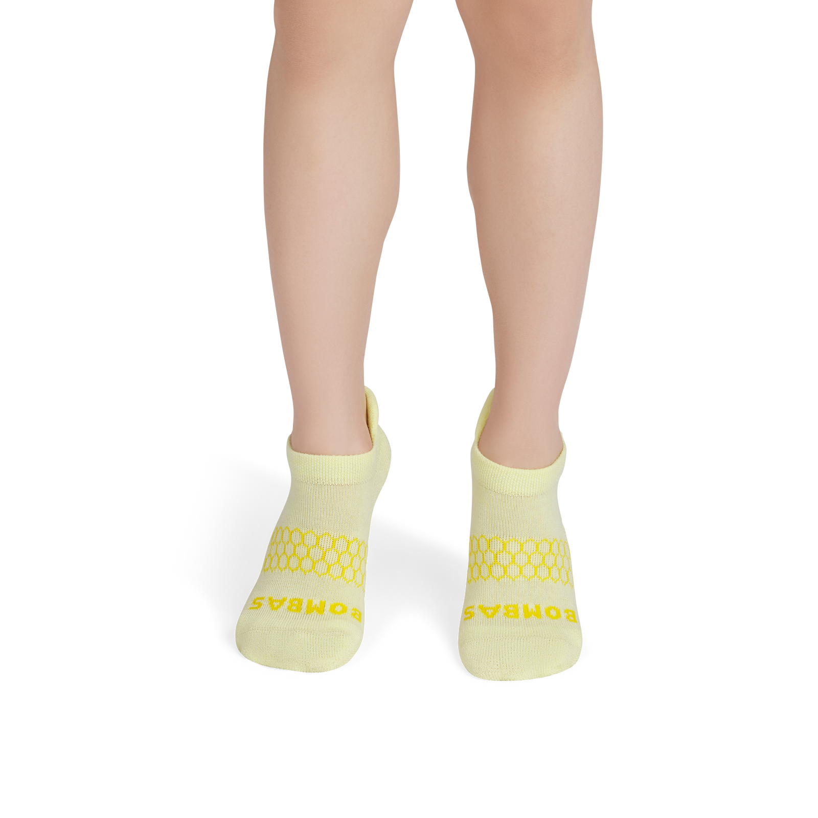 official-bombas::9146-lightmeringue-mustard-junior-unisex-onmodel-2-transparent.png